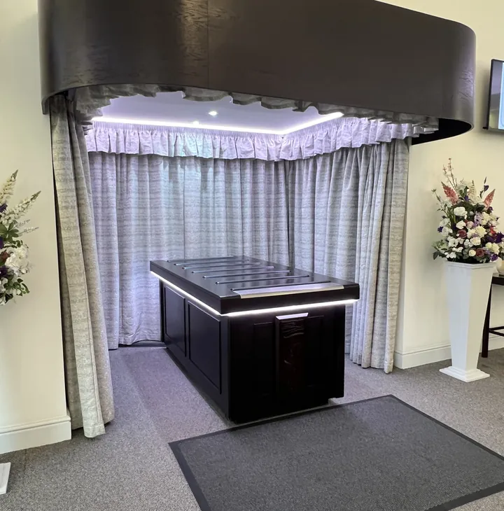 Funeral moment 3: a ceremony room with the catafalque and curtain